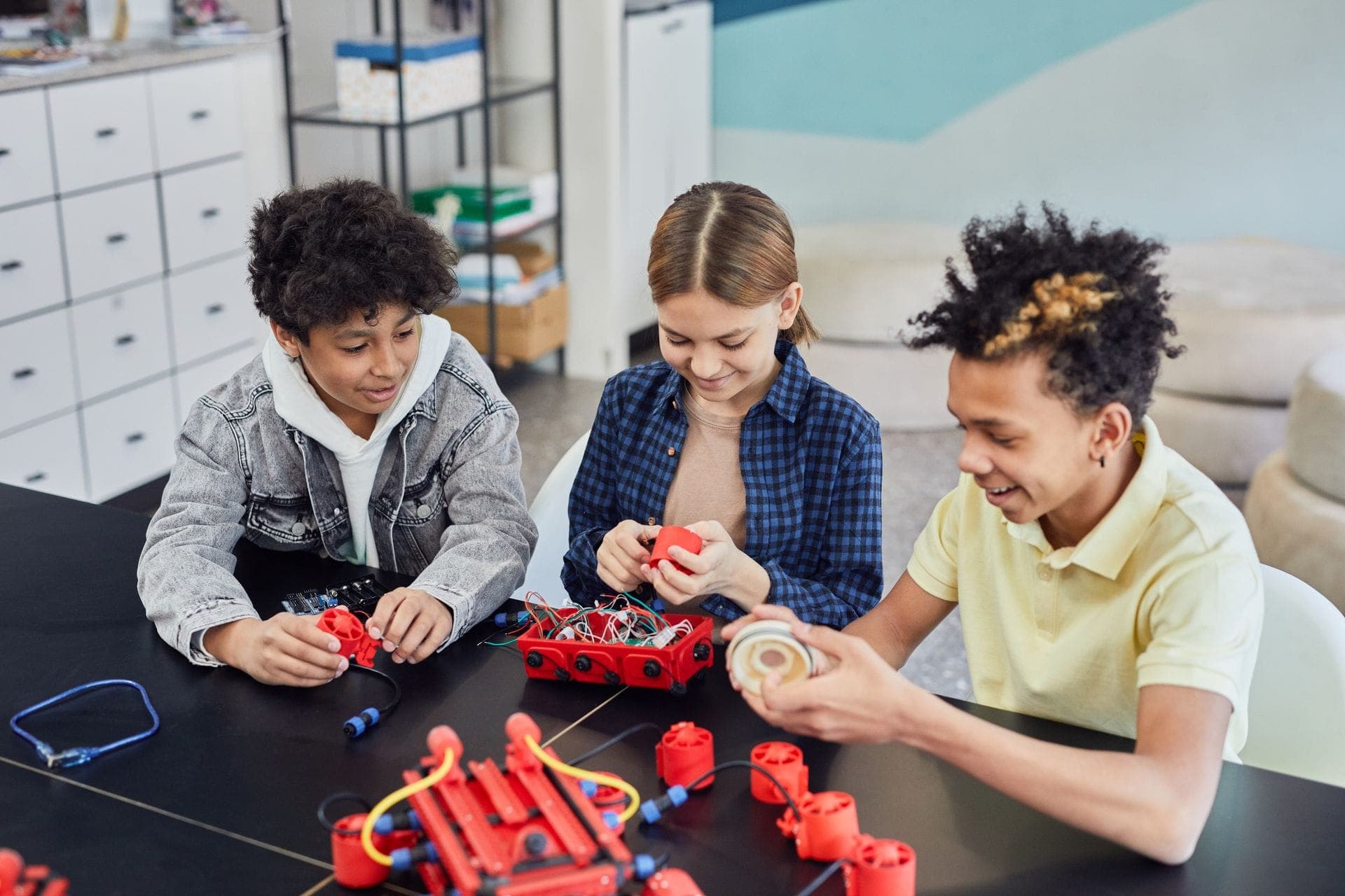 Learners building robots together in a classroom